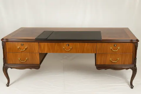 The desk straight on, with the writing pad set into the top.
