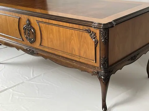 Corner of the desk, where the carving runs down onto the leg.