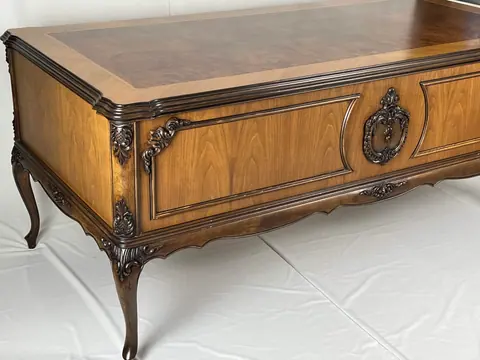 Three-quarter view of the back panel and one cabriole leg.