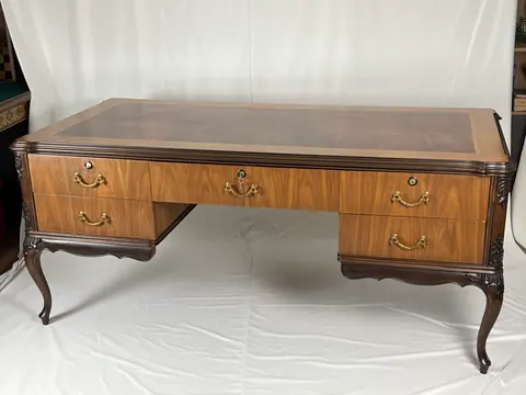 Front of the desk, with three drawers along the frieze.