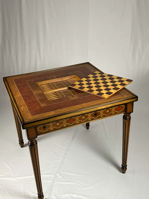 The top part-opened, lifting the chessboard leaf clear of the frame.