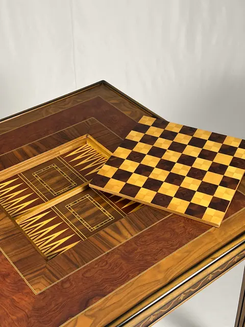 Top fully open. The backgammon well is inlaid beside the chessboard.