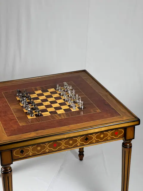 Chess set laid out on the inlaid board.
