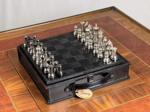 A leather chess case open on the tabletop.