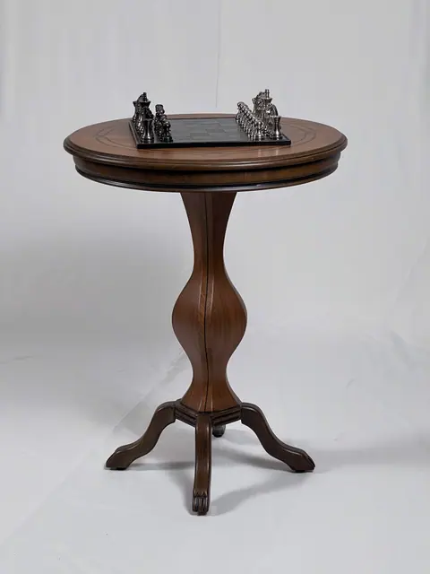 Round side table on a turned pedestal, a chess set on the top.