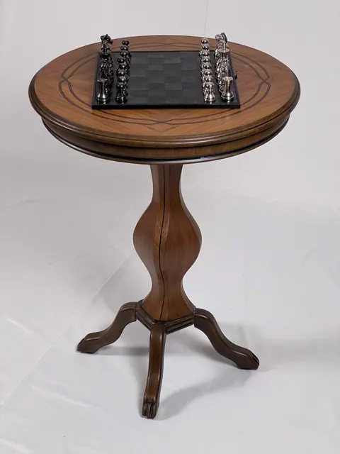 The table from below the top, pedestal rising from three legs.