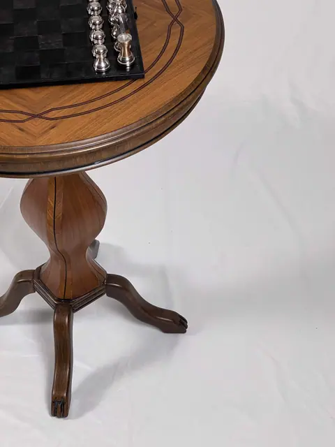 The underside of the top where it meets the pedestal.