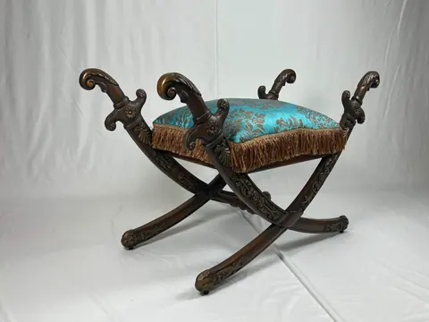 The stool from a step back, where the two halves of the frame cross.